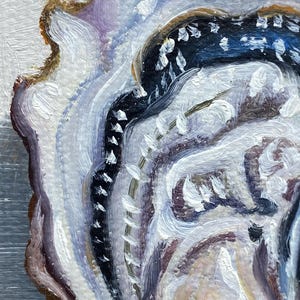 May include: Close-up of an abstract painting of a shell. The artwork features a palette of white, blue, brown, and purple hues. The brushstrokes create a textured, layered effect, with visible details and a sense of depth.