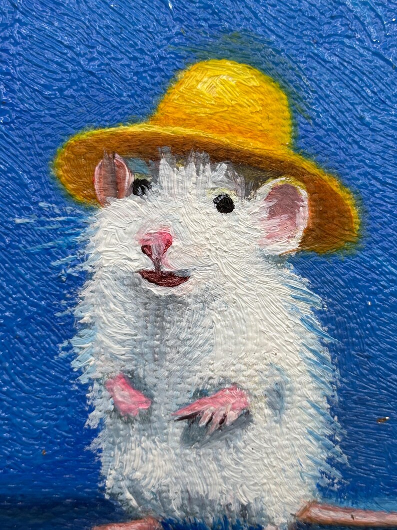 May include: An oil painting of a white rat wearing a yellow hat against a textured blue background. The rat has pink ears, a pink nose, and small paws visible. The brushstrokes are thick and visible, creating a tactile surface on the canvas.