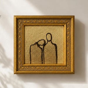 May include: A square wall art piece featuring a textured gold background with a black line drawing of two figures standing side by side. The artwork is enclosed in an ornate, decorative gold frame with a repeating embossed pattern along the edges.