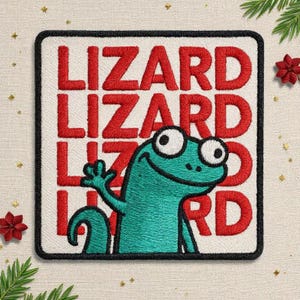 May include: Embroidered patch featuring a teal lizard waving, with the word "LIZARD" stacked in red letters. The patch has a black border and is on a white background. Decorative elements include red flowers and green sprigs.