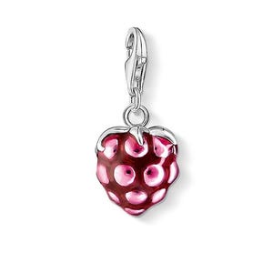 May include: A silver charm in the shape of a pink strawberry with a textured surface. The charm has a silver loop for attaching to a bracelet or necklace.
