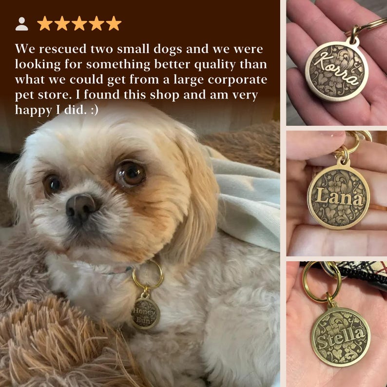 May include: A round, gold-toned metal pet identification tag featuring an intricate, embossed floral pattern and a central horizontal bar engraved with a name. The tag includes a circular split ring for attachment to a collar or harness.