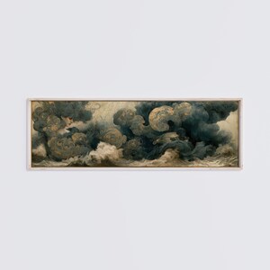 May include: A framed artwork depicting a dramatic, swirling cloudscape in shades of blue, gold, and cream. The painting features a classical style with a hint of a female figure emerging from the clouds. The artwork is rectangular and mounted in a light-colored wooden frame.