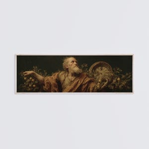 May include: A framed print of an old man with a long white beard, wearing a draped orange robe. He is holding a clock and fruit. The background is dark green, and the print is in a rectangular frame.
