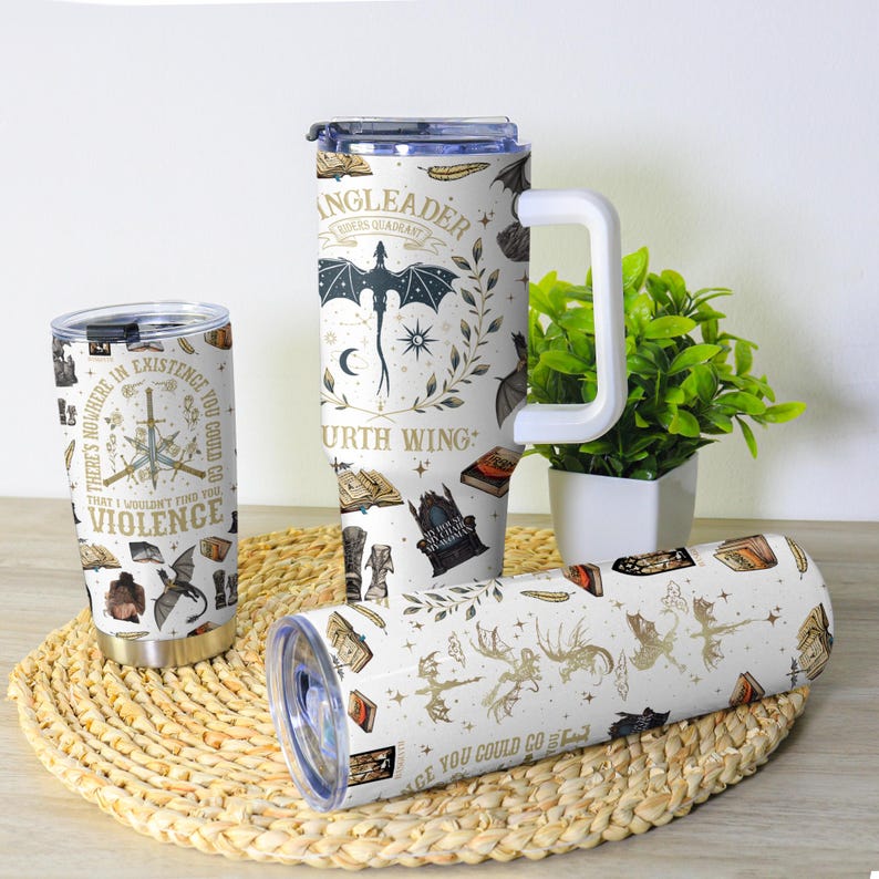 May include: A collection of insulated tumblers with fantasy-themed designs. One tumbler features the text "THERE'S NOWHERE IN EXISTENCE YOU COULD GO THAT I WOULDN'T FIND YOU VIOLENCE". Another has a dragon and the text "INGLEADER FOURTH WING". The third has dragons and the text "AGE YOU COULD GO".