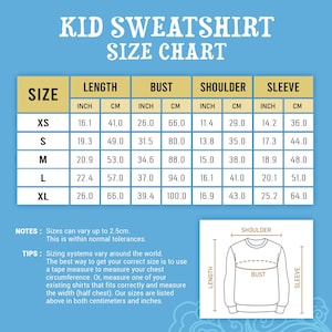 May include: A kid sweatshirt size chart on a blue background. The table lists sizes XS through XL with measurements in inches and centimeters for length, bust, shoulder, and sleeve. A diagram illustrates how to measure a sweatshirt for sizing.