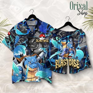 May include: A short-sleeve button-down shirt and matching shorts set featuring a blue and black graphic print of the Pokemon Blastoise, water splashes, and a Pokeball icon. The text Blastoise is printed on both pieces in a bold, stylized font.