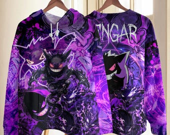 May include: A purple hooded sweatshirt featuring a graphic print of the character Gengar. The design includes swirling purple energy patterns, a large Gengar illustration, and the text GENGAR printed in a stylized white font on the upper right side.