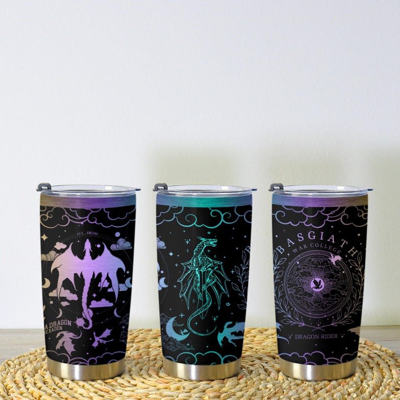 May include: Three stainless steel insulated tumblers with black backgrounds and dragon designs. Each tumbler features a different dragon illustration in shades of purple, teal, and blue, with text that reads "A Dragon's Lair", "Basgiath War College", and "Dragon Rider".