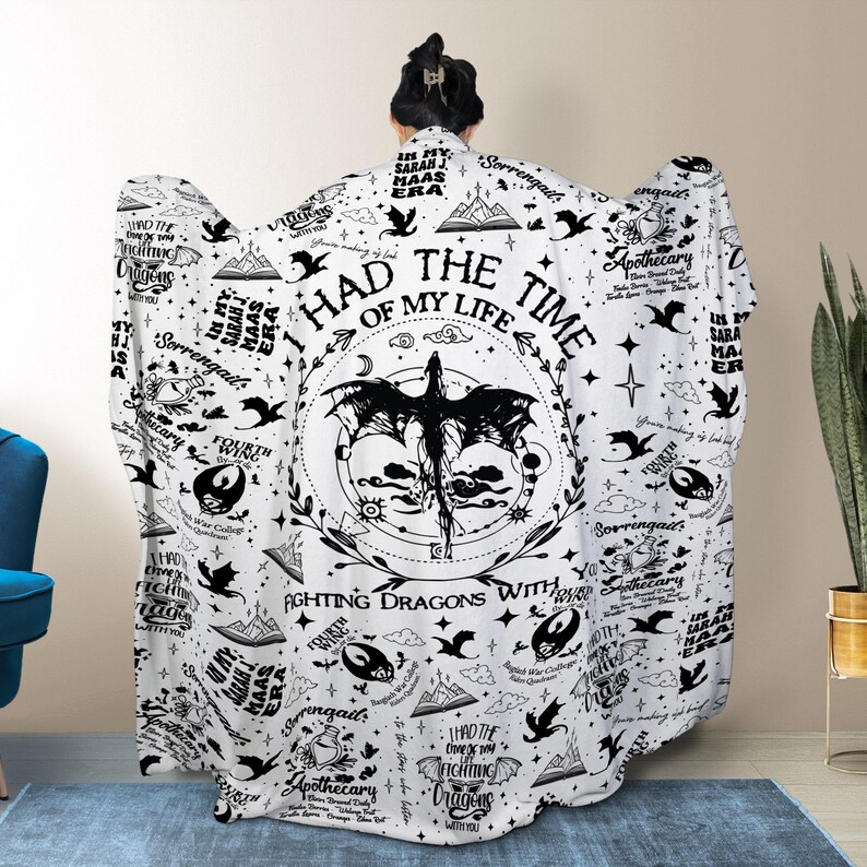 May include: A white hooded blanket featuring a black dragon design with the text "I had the time of my life fighting dragons with you." The blanket has a repeating pattern of stars, apothecary bottles, and other graphics.