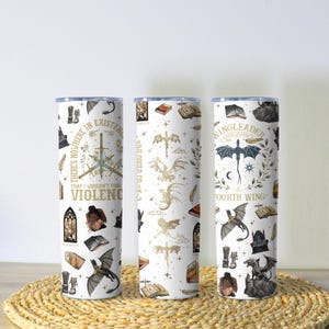 May include: Three white insulated tumblers with fantasy-themed designs. One features a sword and the text "THERE'S NOWHERE IN EXISTENCE THAT I WOULDN'T FIND VIOLENCE". Another has gold dragons. The third has a dragon and the text "WINGLEADER".