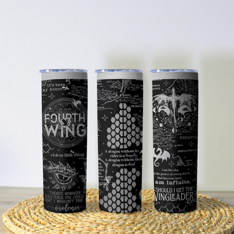 May include: Three black and white insulated tumblers with fantasy-themed designs. Each tumbler features text and illustrations, including dragons and maps. The text includes phrases like "Fourth Wing" and "Should I get the Wingleader?"