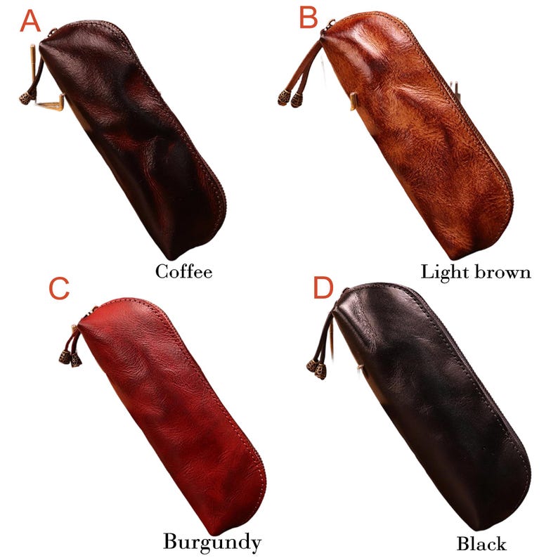 May include: Four leather pencil cases in coffee, light brown, burgundy, and black. Each case has a zipper closure and a small decorative tassel. The cases are shown against a white background.