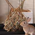 Hanging Travel Feeder, Slow Feed Hay Net for Rabbits & Guinea Pigs, Durable Pet-Friendly, Soft Woven Mesh Cover product logo