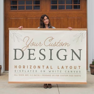 May include: A large rectangular canvas with the text "Your Custom DESIGN" in a serif font. The canvas is displayed horizontally and has a light beige background with a wooden frame. The text "HORIZONTAL LAYOUT" is also visible.