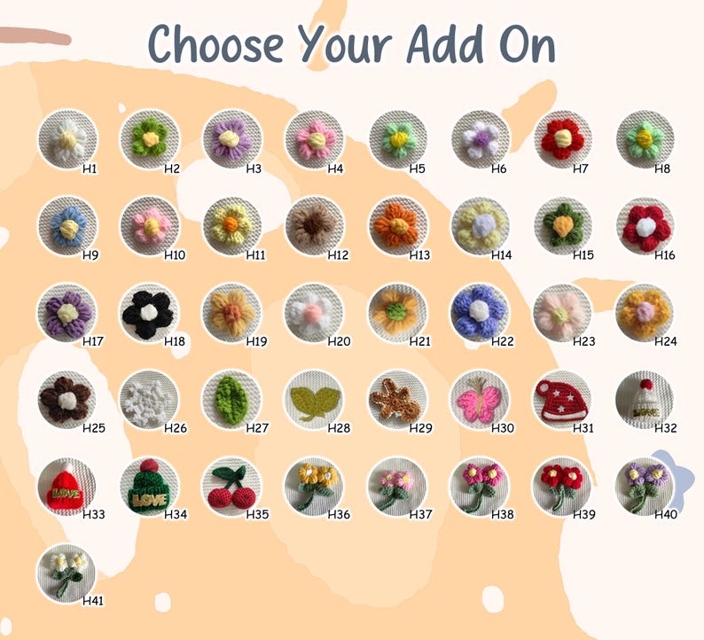 May include: A collection of crocheted embellishments in various shapes and colors, including flowers, leaves, and a butterfly. The text "Choose Your Add On" is at the top. Each design is labeled with a letter and number combination.