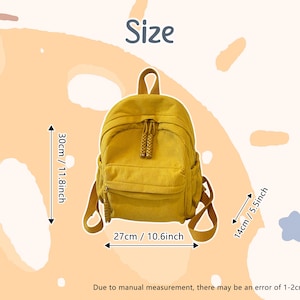May include: A yellow corduroy backpack with a top handle, front pocket, and adjustable straps. The backpack measures 11.8 inches high, 10.6 inches wide, and 5.5 inches deep. The text "Size" is at the top.