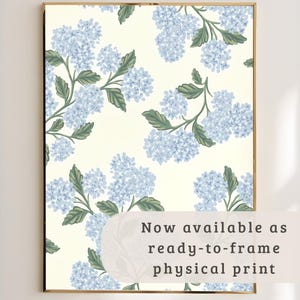 May include: A framed print featuring a repeating pattern of light blue hydrangea flowers with green leaves on a cream background. The print is ready to frame and has the text "Now available as ready-to-frame physical print".