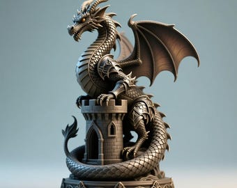 May include: A detailed, metallic dragon statue perched on a miniature castle tower. The dragon has intricate scales, horns, and wings, with a coiled tail. The statue is a dark, muted silver colour, with a decorative base.