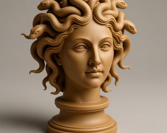 May include: A tan-colored sculpture of Medusa's head, featuring intricately detailed snakes in place of hair. The sculpture has a classical aesthetic, with a serene facial expression and a pedestal base. The overall design is smooth and elegant.