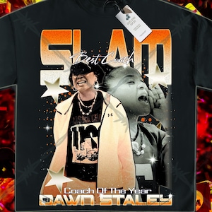May include: Black t-shirt with a graphic print of a basketball coach with the text "SLAM Best Coach Coach Of The Year DAWN STALEY" in orange and white.
