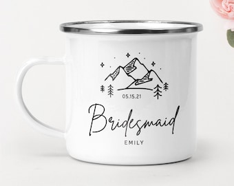 May include: White enamel mug with a black mountain range design and the text "05.15.21 Bridesmaid EMILY".