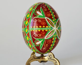 Lviv, Ukraine. 06th Apr, 2023. A young woman makes Easter eggs. A young  woman in traditional Ukrainian clothing makes Easter eggs using ancient  technology. Pysanka is an ancient tradition, one of the