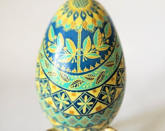 Ukrainian goose pysanka egg sunflower pysanka symbol of my culture in blue and yellow colors