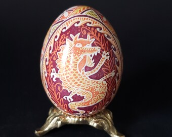 2024 Year of the Dragon pysanka on chicken eggshell real Ukrainian Easter egg in rich gold red and orange shades