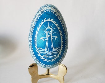 Christ Resurrection pysanka Religious Easter egg with Christmas Nativity on one side and Easter scene on another