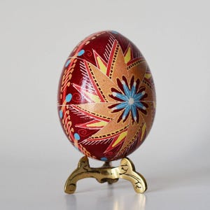 Burgundy red Ukrainian Easter pysanka hand-painted decorative egg ornament collectible pysanky art eggs folk art of Ukraine windmill pattern