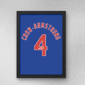 May include: Framed print featuring a blue background with the name "CROW-ARMSTRONG" arched across the top in red lettering. A large red number "4" with a white outline is centered below the text. The print is in a black frame.