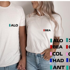 T-shirt met initialen F1 team, Alonso, Stroll, Russell, Antonelli, Bearman, Ocon, Gasly, Colapinto, Hadjar, Lawson, Formula 1-merchandise