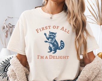 Comfort Colors® First of All I’m a Delight Raccoon Shirt, Funny Sarcastic Quote Tee, Humor Animal Graphic Shirt, Gift for Sarcasm Lovers