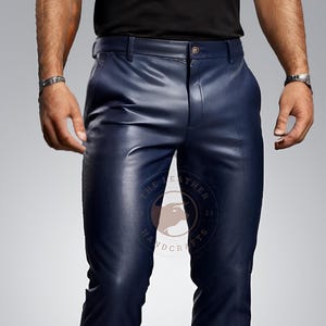 May include: A pair of dark blue leather trousers with a zip fly and belt loops.