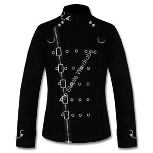 May include: Black jacket with a high collar, diagonal zip, and multiple silver metal accents. Features decorative metal rings, rivets, and a chain detail on the cuffs. The text "The Staple Wardrobe" is printed on the jacket.