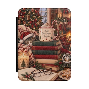 May include: A rectangular e-reader case featuring a festive holiday scene with a sleeping tabby cat in a Santa hat, a stack of books, a mug with the text Just One More Chapter, a lit candle, a pair of reading glasses, and a snowflake cookie.