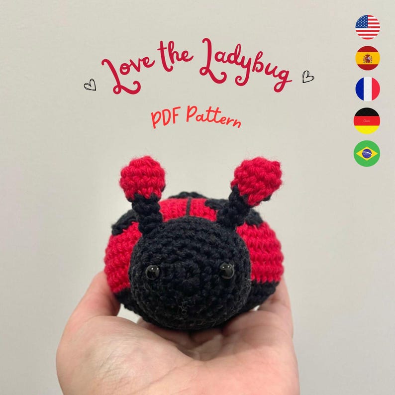 May include: A crocheted ladybug toy with a red and black body, two antennae, and black eyes. The text above reads Love the Ladybug PDF Pattern, accompanied by small heart icons and a vertical column of five circular national flag icons.