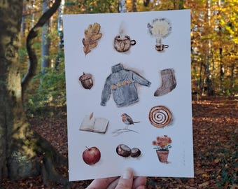 May include: Watercolor illustration featuring autumn-themed elements. Depicted are a sweater, acorn, apple, open book, bird, and other seasonal items. The artwork is held against a backdrop of a forest with fall foliage.