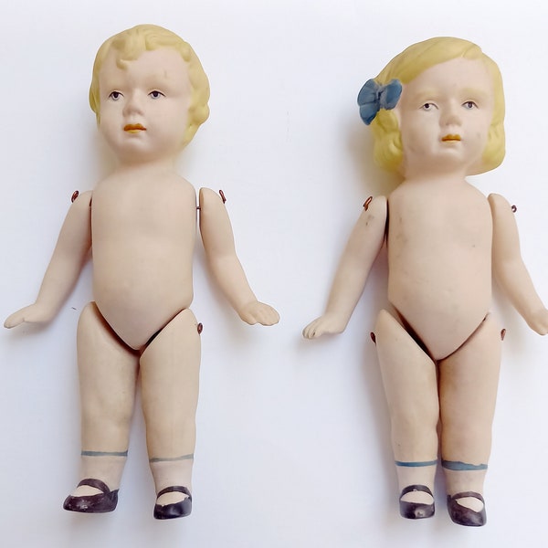2 bisque dolls boy and girl bisque doll