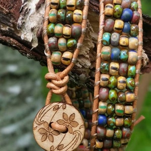 Leather double wrap bracelet, natural leather cord, multicolor czech glass beads, wooden flower button.  Rustic and fun, made with love