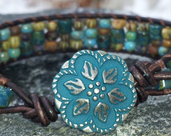 Hand loomed leather bracelet/picasso glass czech beads/off the beadin path neosho/turquoise aqua copper button/brown leather/hippiebohofun/