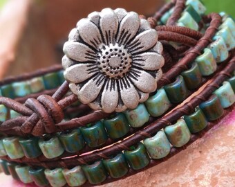 turquoise triple wrap leather bracelet/Little bits of czech glass tubes/rustic pewter sunflower clasp/Hand stitched with good energy/fun/