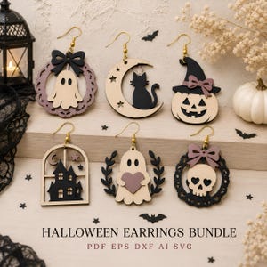 May include: A set of six Halloween-themed dangle earrings featuring laser-cut designs including a ghost with a bow, a black cat on a crescent moon, a pumpkin with a witch hat, a haunted house, a ghost holding a heart, and a skull in a wreath.