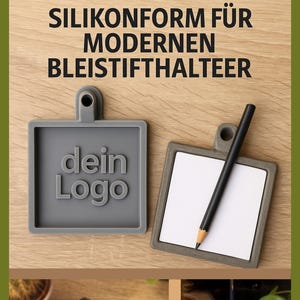 May include: Two grey silicone pencil holders with a square design and a loop for hanging. One has the text "dein Logo" and the other holds a pencil. The top text reads "SILIKONFORM FÜR MODERNEN BLEISTIFTHALTEER".