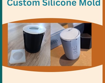 May include: The image displays custom silicone molds. The text "Custom Silicone Mold" is at the top. The image shows a black mold with a white rim, a grey mold, and a square mold. The text "Molds & Casted Products Can Be Sold" and "Customized Size Available on Request" are also present.