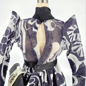 Avant-Garde Black & White Blouse, Ruffle Hem Skirt, Elegant Clutch: Chic Ensemble