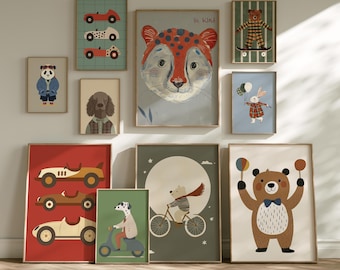 May include: A collection of framed art prints featuring animal illustrations and vintage cars. The artwork includes a panda in a jacket, a dog in a plaid shirt, a cheetah with orange spots, and a bear on a skateboard. The text "Be Kind" is visible.