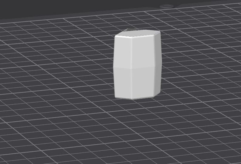 May include: A white, geometrically shaped, 3D printed object with a smooth surface.