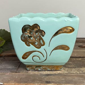 May include: A distressed wooden sign, reading "Welcome to our home" in white. The sign has a rustic finish, ideal for adding a welcoming touch to a home's entrance.